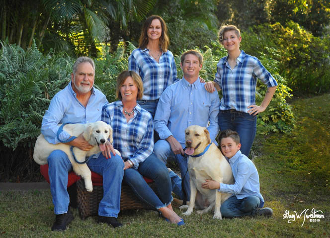 family at home in plaid shirts