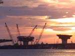 Bridge cranes at sunsets